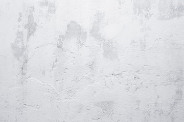 Old grunge white wall background. Texture of aged whitewashed wall