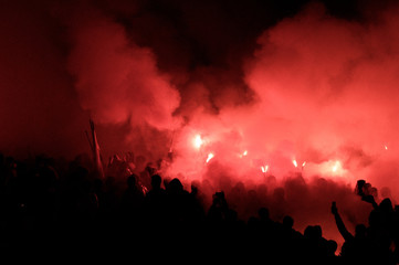 Fototapeta na wymiar football fans use pyrotechnics after their club win championship. great bonfire of the yearly celebration 