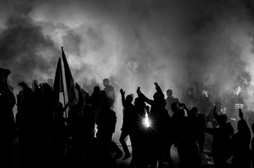  football fans use pyrotechnics after their club win championship.  great bonfire of the yearly celebration 