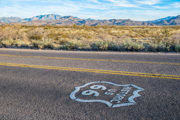 Historic US Route 66 highway sign on asphalt
