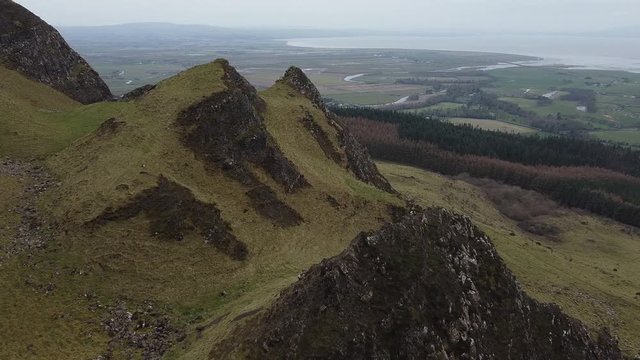 Drone aerial footage of Binevenagh Mountain and cliffs, North Sperrins, Causeway Coast and Glens, Limavady, County Londonderry, Northern Ireland