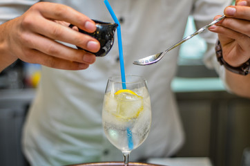 Shanker making cocktail with lemon and chocolate,ice-coffee with lemon and chocolate