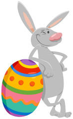 cartoon Easter bunny with big colored egg