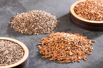 Linum usitatissimum - Salvia hispanica. Healthy chia and flaxseed seeds.