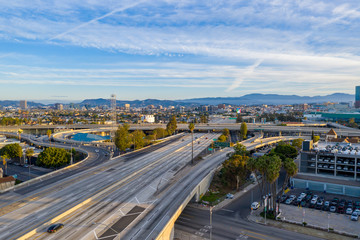 Aerial view of Los Angeles, California USA freeway or highway with street view on blue sky day.