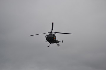 Fototapeta na wymiar ZENICA / BOSNIA AND HERZEGOVINA - May 17, 2019 : EUFOR helicopter flying in the air, helicopter rescue