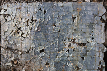 Fototapeta premium Broken glass on floor background, top view, abstract