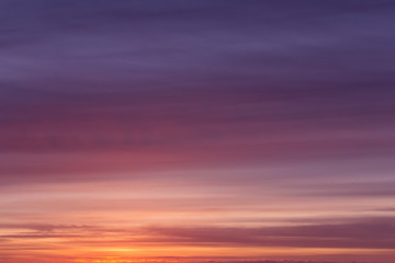 Dramatic soft sunrise, sunset pink violet orange blue sky with clouds background texture