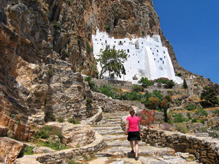Woman climbing stairs of Panagia Hozoviotissa monastery