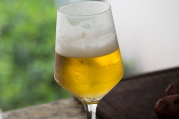 glass of beer outside barbecue
