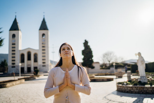 Religious Woman Praying To God Due To Novel Coronavirus Covid-19 (2019-nCoV) Outbreak.Woman In Emotional Stress And Pain.Christianity.Strong Religion,faith And Hope Concept.Enlightenment