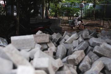 makassar, indonesia march 22nd 2020 workers build a room with bricks and cement