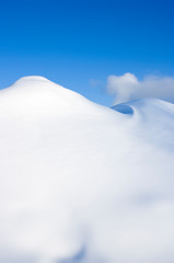 Fototapeta na wymiar snowy winter mountains and blue sky