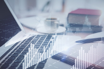 Double exposure of financial chart drawing and desktop with coffee and items on table background. Concept of forex market trading