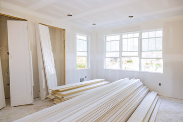 Interior construction of housing project with door and molding installed