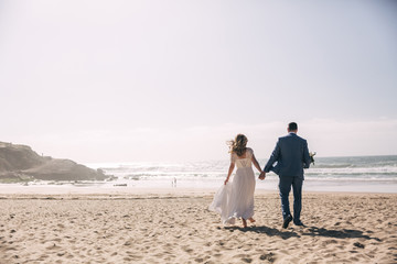 newlyweds on the ocean beach