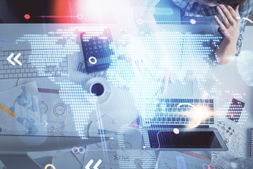 Double exposure of man and woman working together and world map hologram drawing. international network concept. Computer background. Top View.