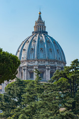 Fototapeta na wymiar Gorgeous St. Peter's Basilica Dome on a sunny day at the Vatican in Rome Italy