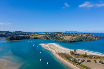 Aerial View from the Beach, Green Trees, City Streets and Waves of Omaha in New Zealand - Auckland Area	 - obrazy, fototapety, plakaty