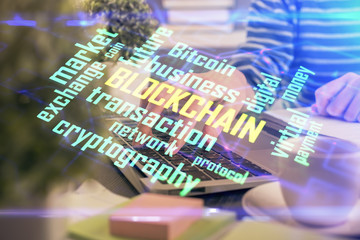 Double exposure of woman hands typing on computer and crypto market theme hologram drawing. Blockchain concept.