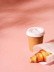 Cup of coffee and croissant.