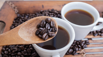 Dark rose Coffee Beans and coffee cup Background