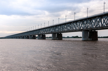 Russia, Khabarovsk, August 2019: Road bridge on the Amur river in the city of Khabarovsk in the summer
