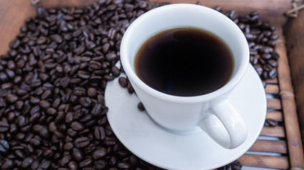 Dark rose Coffee Beans and coffee cup Background