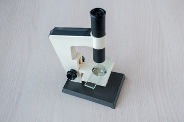 Still life : Microscope with glass for analysis on the table