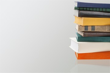 Fototapeta premium Stack of old study books on the desk