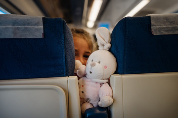 Child peeking between seats.Child sitting in front seat.Children on plane/bus/train rides.Children...