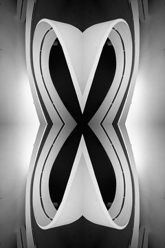 Rampa espelhada de forma geom&eacute;trica em preto e branco. Um X preto em alto contraste com linhas curvas.