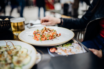 Gourmet prawn salad in a modern restaurant.Colorful healty lunch.Seafood dinner served. Low calorie food, low carb lifestyle eating out.Keto meal.Delicious colorful shrimp salad recipe.