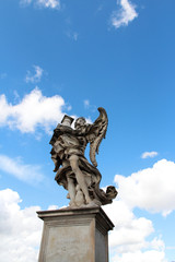 Fototapeta na wymiar Angel Carrying the Column by Antonio Raggi at Castel Sant'Angelo, Rome, Italy