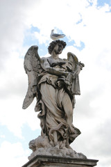Angel Carrying the Scourge by Lazzaro Morelli at Castel Sant'Angelo and a seagull stand on top statue, Rome, Italy