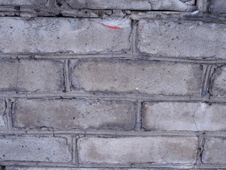 fragment of a gray brick wall