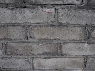 fragment of a gray brick wall