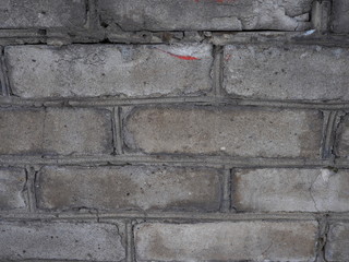 fragment of a gray brick wall