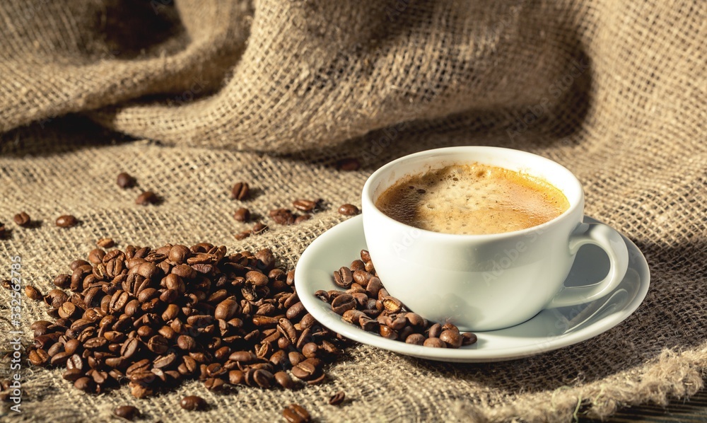 Canvas Prints Aroma coffee beans and cup of coffee on the wooden table