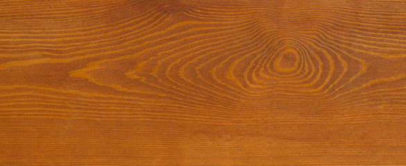 The texture of a pine board with an interesting pattern.