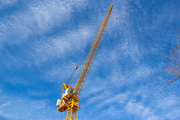 Fototapeta na wymiar Yellow construction crane