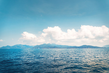 Clear water on the island,Bright blue sea and wooden boat The tourism