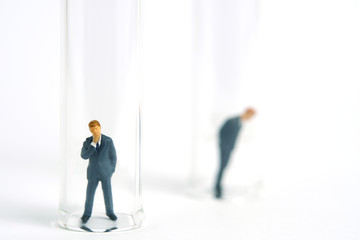 Health conceptual miniature people photography &ndash; testing specimen, a businessman on a laboratory tube