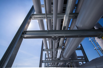 Industrial piping system over rooftop of factory