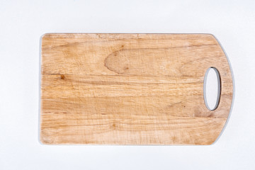 Old cutting board on a white background. Place for text
