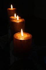 Candles in dim light from righ and left side