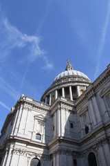 Fototapeta na wymiar The dome of St Paul's Cathedral against the blue sky in spring, London, UK