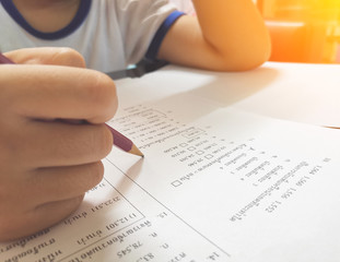 asia kid is doing homework