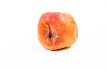 One Red rotten apple on white background