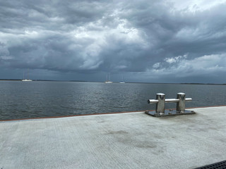 docking pier storm clouds
